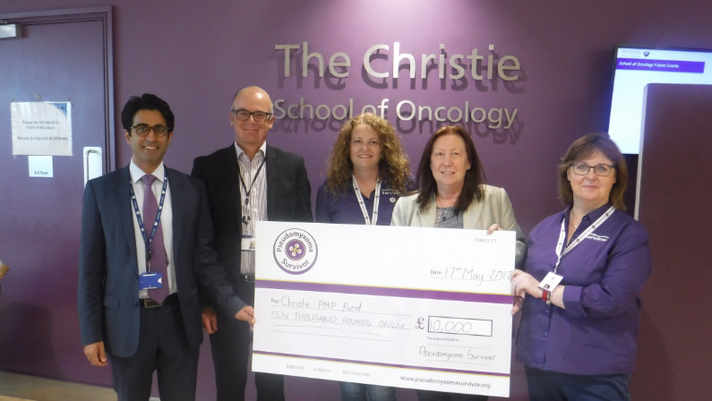 Susan and Angela present the peritoneal surface malignancy team at the Christie with a cheque